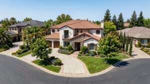 Elegant home with landscaped yard and driveway.